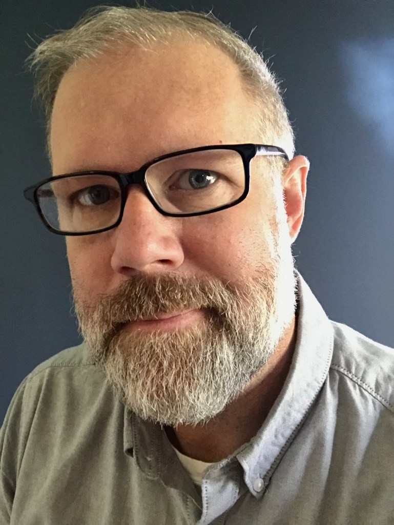 bearded man with glasses